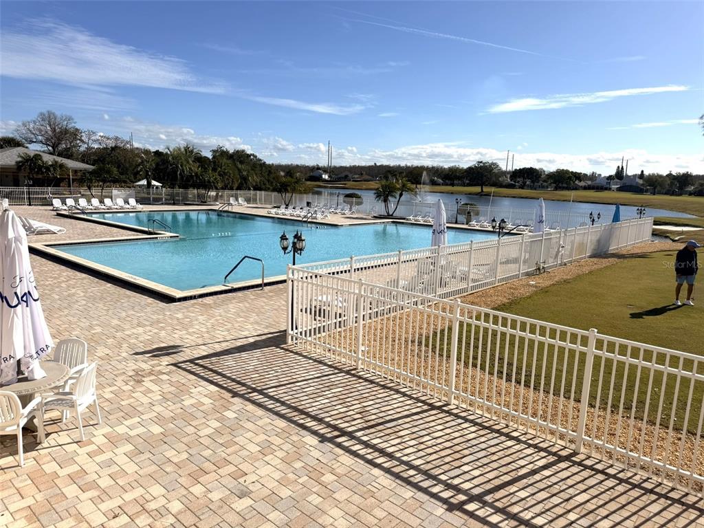3244 Candle Ridge Drive, Unit 202 Orlando, FL 32822 - Photo 23 of 61 a view of a swimming pool with a patio