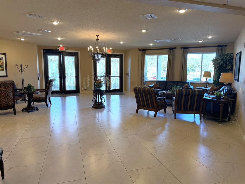 3244 Candle Ridge Drive, Unit 202 Orlando, FL 32822 - Photo 28 of 61 a lobby with furniture and entryway