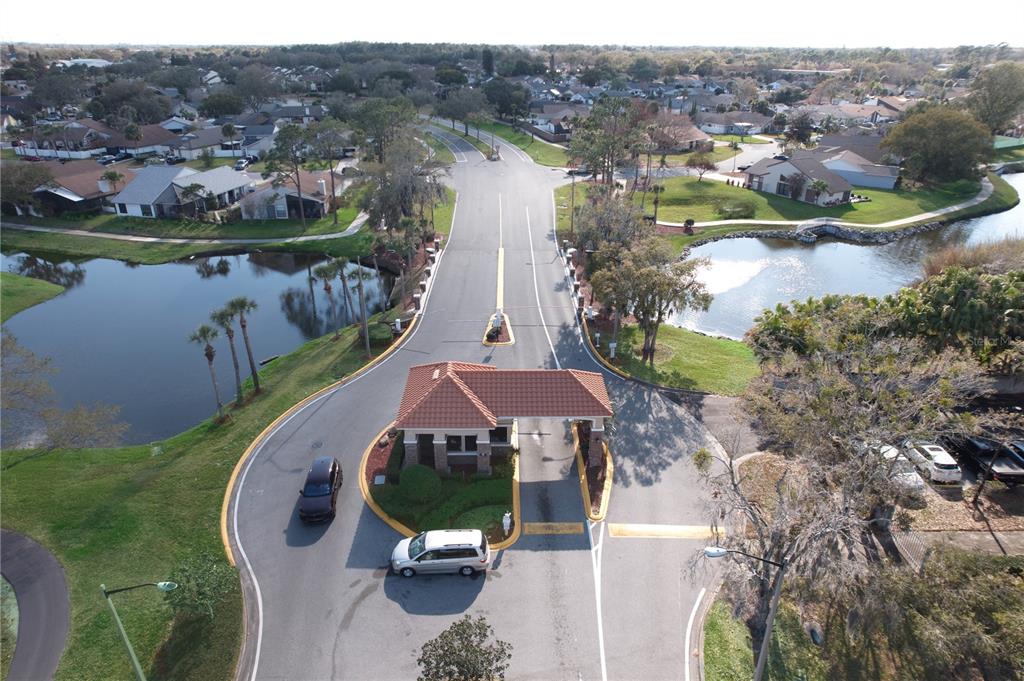 3244 Candle Ridge Drive, Unit 202 Orlando, FL 32822 - Photo 38 of 61 an aerial view of a house with a garden and lake view