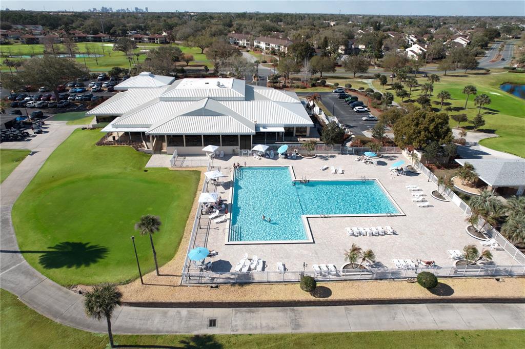 3244 Candle Ridge Drive, Unit 202 Orlando, FL 32822 - Photo 43 of 61 an aerial view of a house with a yard swimming pool patio and lake view