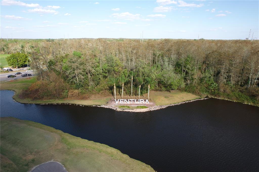3244 Candle Ridge Drive, Unit 202 Orlando, FL 32822 - Photo 59 of 61 a view of a lake with a mountain in the background