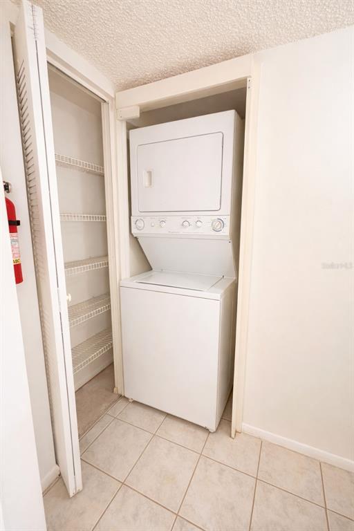 3244 Candle Ridge Drive, Unit 202 Orlando, FL 32822 - Photo 7 of 61 a utility room with dryer and washer