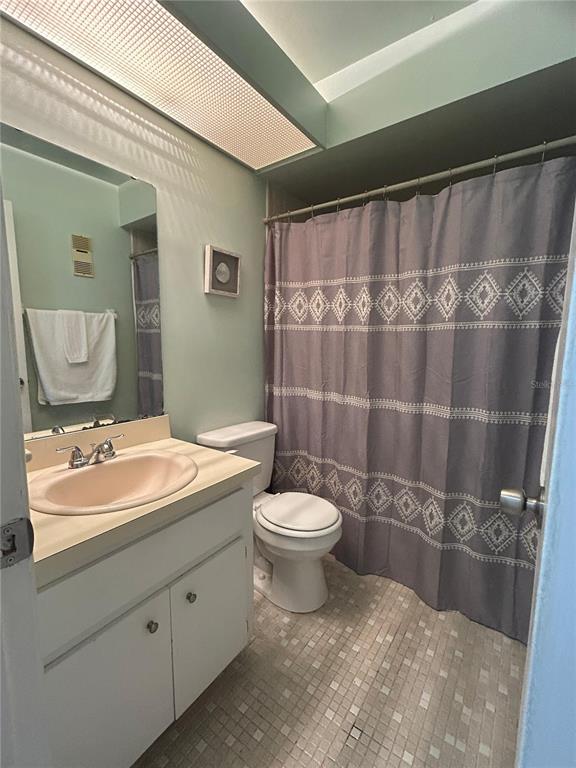 3244 Candle Ridge Drive, Unit 202 Orlando, FL 32822 - Photo 8 of 61 a bathroom with a double vanity sink toilet and a mirror