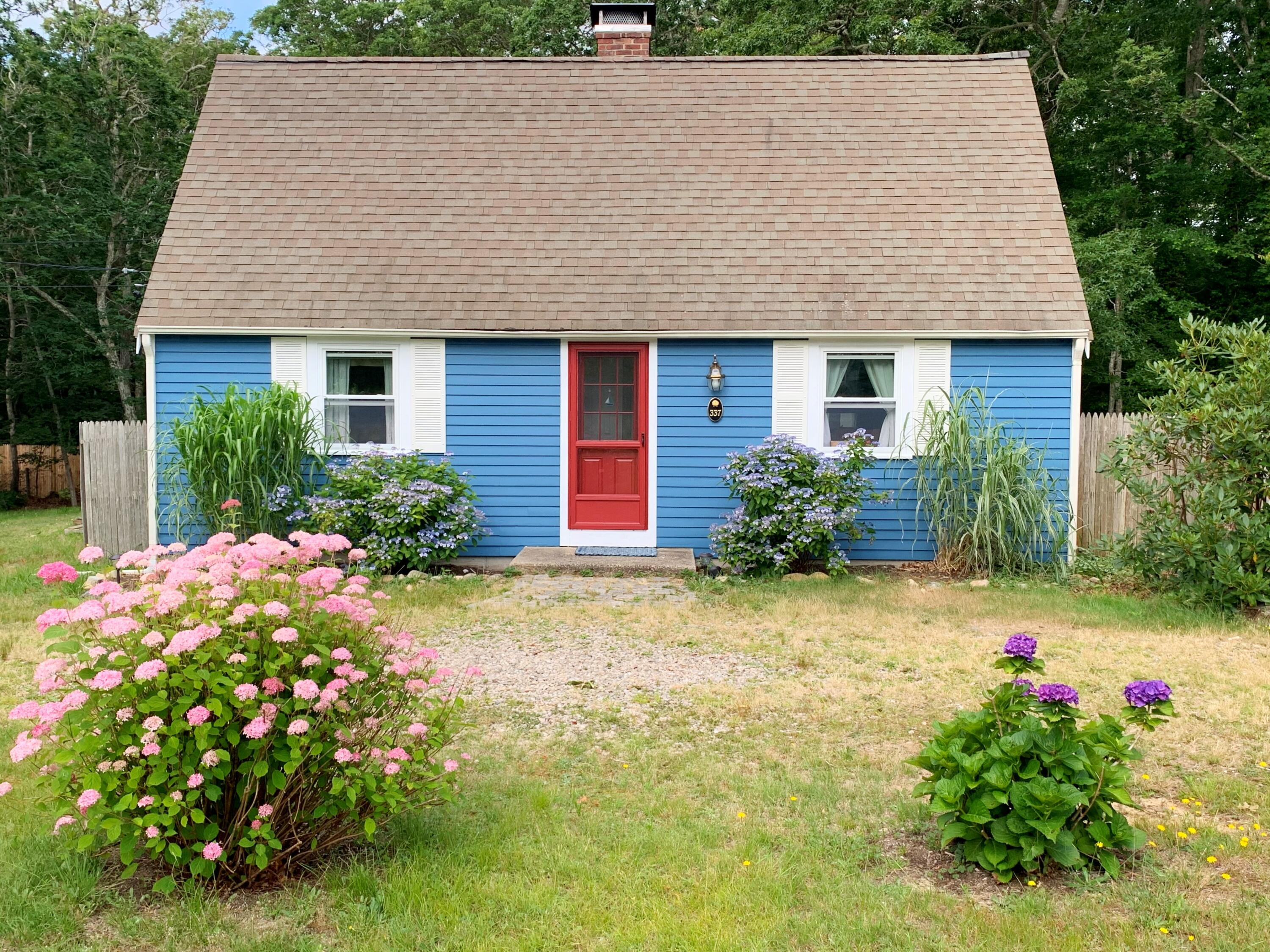 front view of a house with a yard
