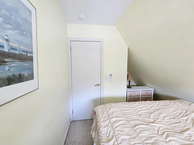 a view of a backyard with seating space