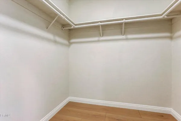 a view of a room with shelf on the wall