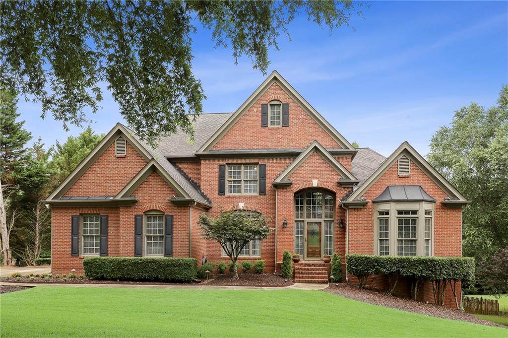 508 Settles Road Suwanee, GA 30024 - Photo 1 of 1 Stately 3 side brick beauty with outdoor landscape lighting - stunning at night as well!
