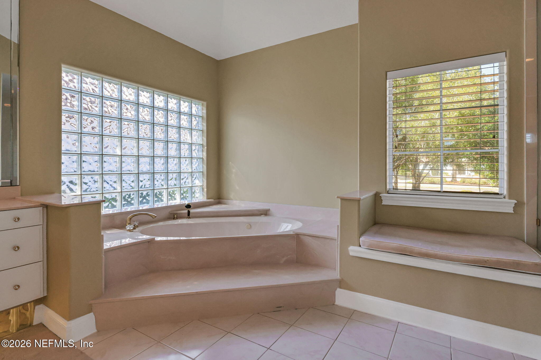 196 Governors Road Ponte Vedra Beach, FL 32082 - Photo 36 of 117 a bathroom with a bathtub and a window