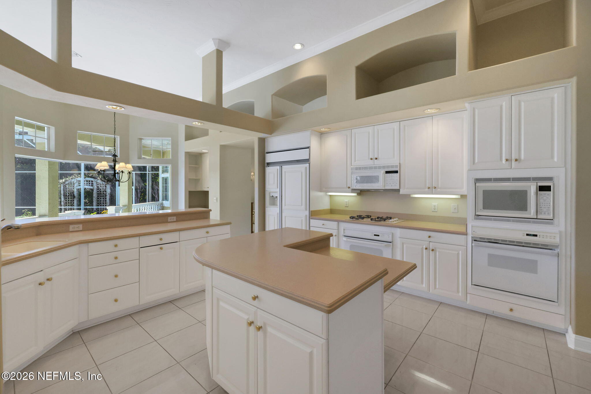 196 Governors Road Ponte Vedra Beach, FL 32082 - Photo 41 of 117 a kitchen with granite countertop white cabinets and white appliances