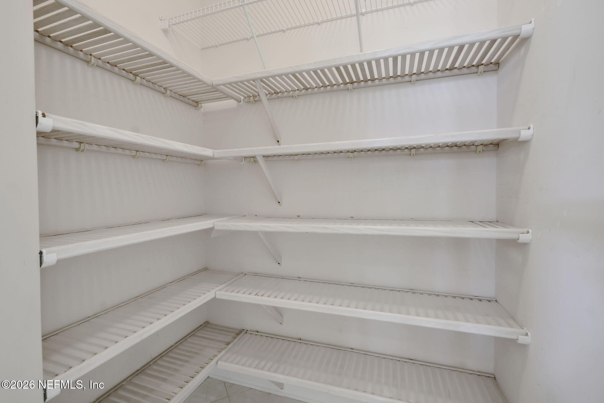 196 Governors Road Ponte Vedra Beach, FL 32082 - Photo 49 of 117 a view of walk in closet with empty racks