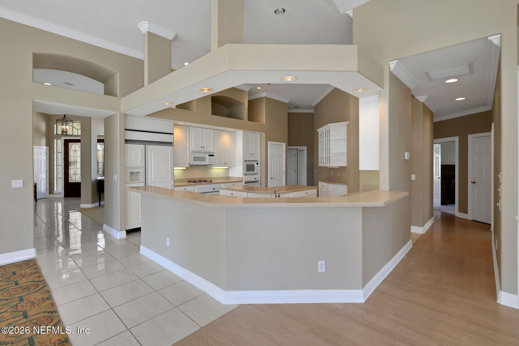 196 Governors Road Ponte Vedra Beach, FL 32082 - Photo 50 of 117 a view of a kitchen with kitchen island stainless steel appliances refrigerator stove microwave and cabinets