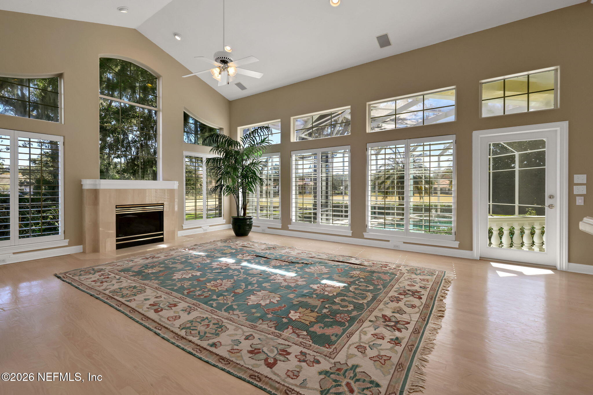 196 Governors Road Ponte Vedra Beach, FL 32082 - Photo 56 of 117 a view of an empty room with wooden floor and a fireplace