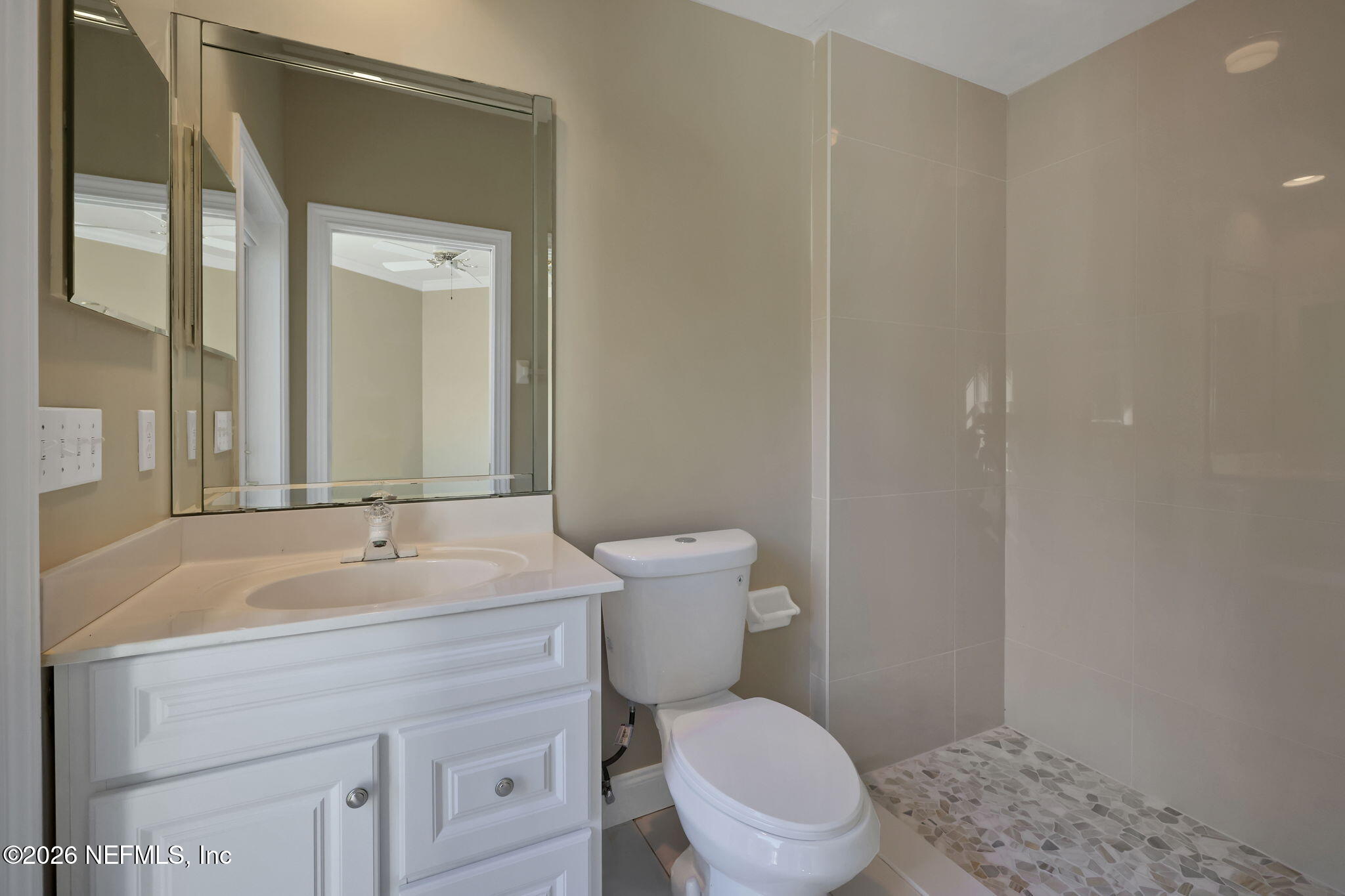 196 Governors Road Ponte Vedra Beach, FL 32082 - Photo 62 of 117 a bathroom with a sink a toilet and a mirror