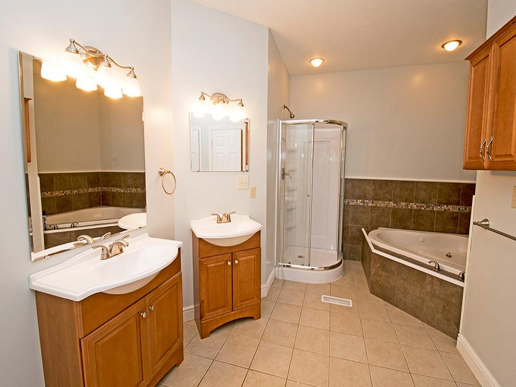 850 McCleary Road Hookstown, PA 15050 - Photo 13 of 23 Master bath with jet tub, corner shower. Dual vanity sinks. Large walk in closet. Ceramic tile flooring.