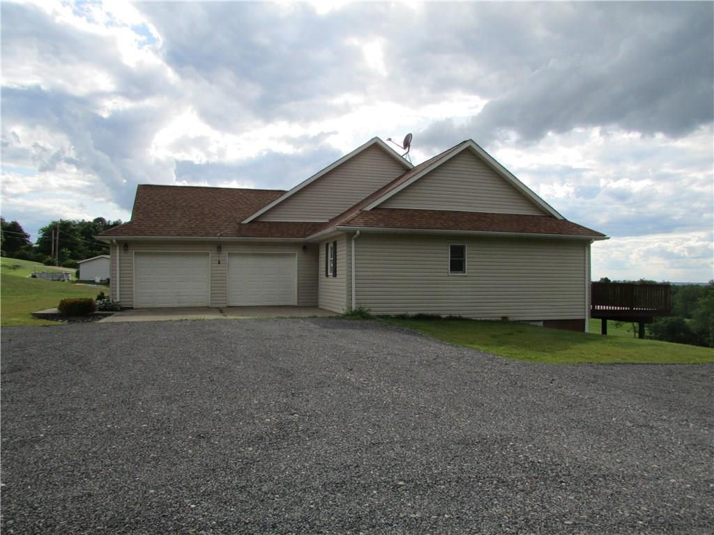 850 McCleary Road Hookstown, PA 15050 - Photo 3 of 23 Side of exterior with 2 car attached garage and side exterior entry to home.