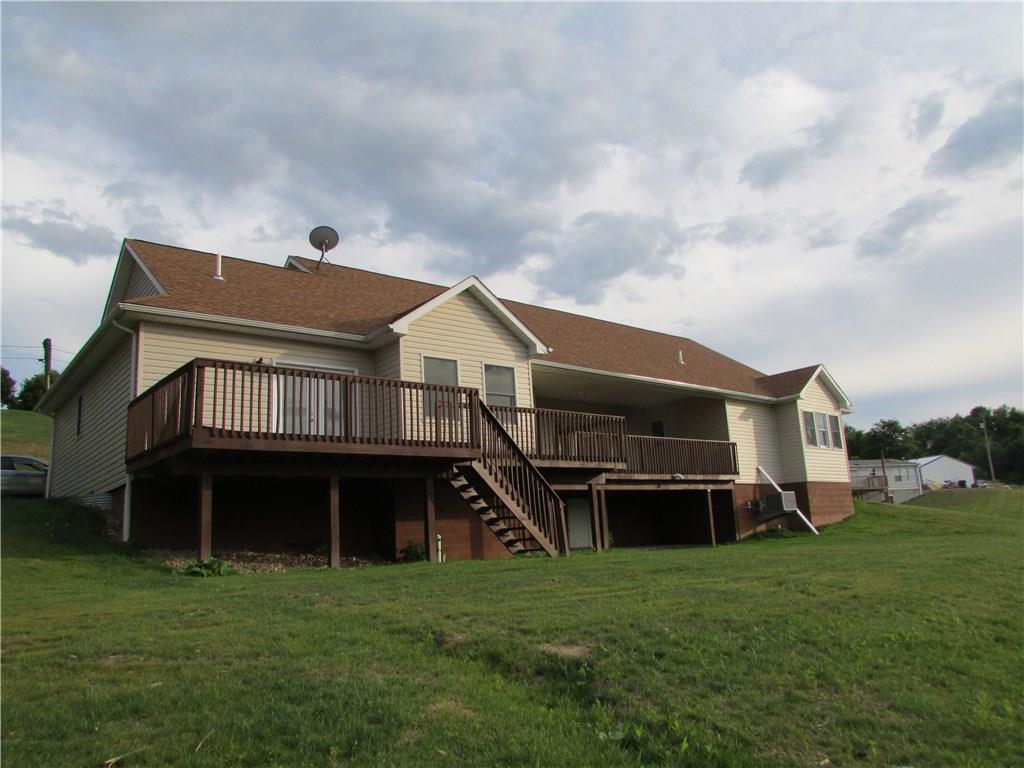 850 McCleary Road Hookstown, PA 15050 - Photo 4 of 23 Rear exterior of home. Deck wraps around the rear of home. Walkout to deck from living room. Walk off deck to rear yard.