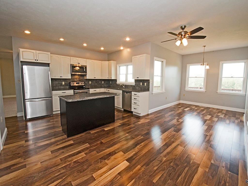 850 McCleary Road Hookstown, PA 15050 - Photo 5 of 23 Open kitchen to eat in area. Granite counter tops and center island for bar stools. New stainless steel appliances. Tile backsplash. Kraft Maid cabinets. Walnut flooring.