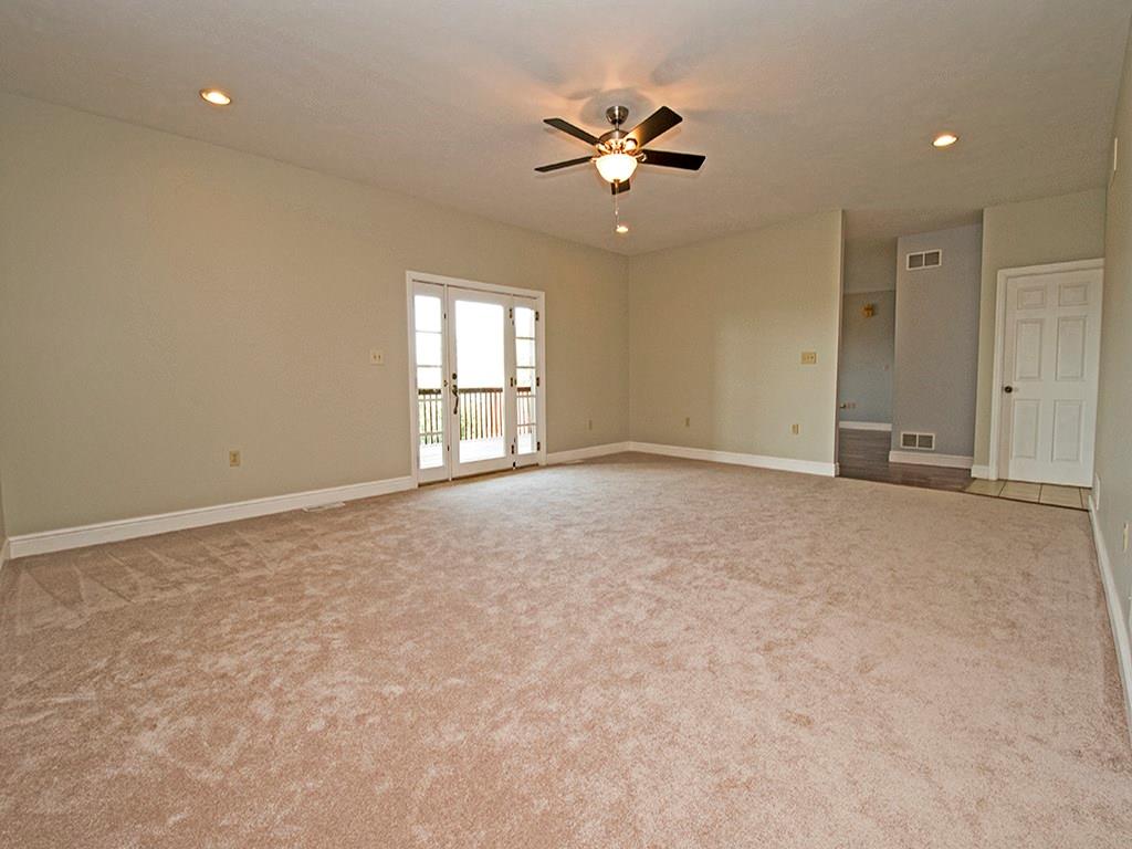 850 McCleary Road Hookstown, PA 15050 - Photo 9 of 23 Large livingroom with recessed ceiling lights plus fan. Walkout to rear deck.