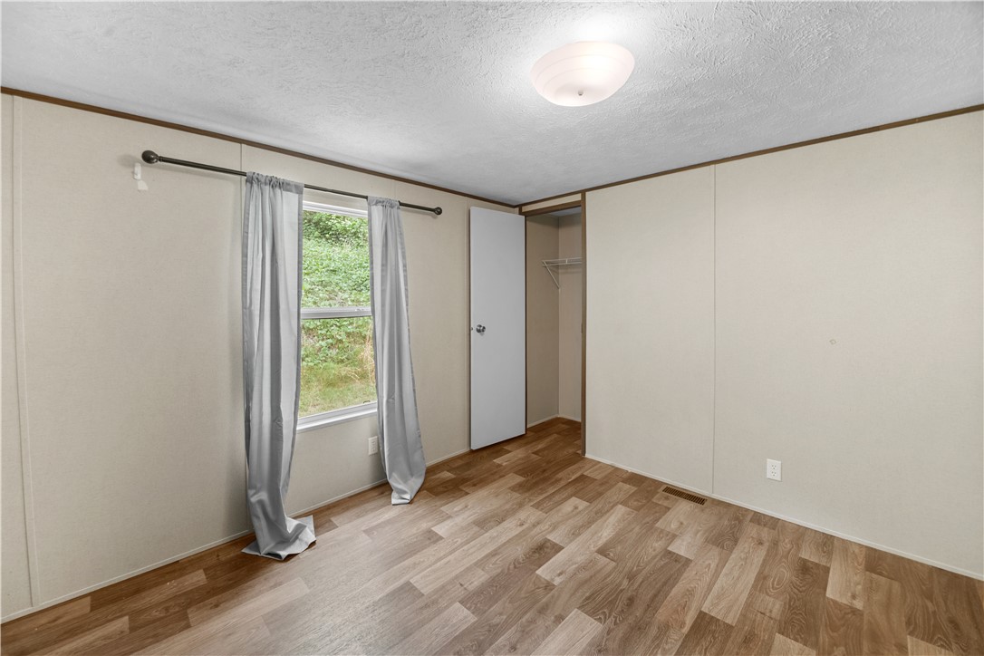 1188 Old Liberty Road Easley, SC 29640 - Photo 23 of 28 This spacious bedroom offers ample natural light and a practical layout for comfortable living.