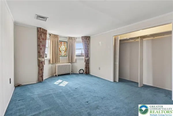 a view of a hallway with washer and dryer