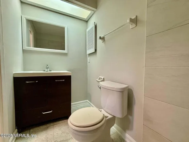 a bathroom with a toilet and a sink