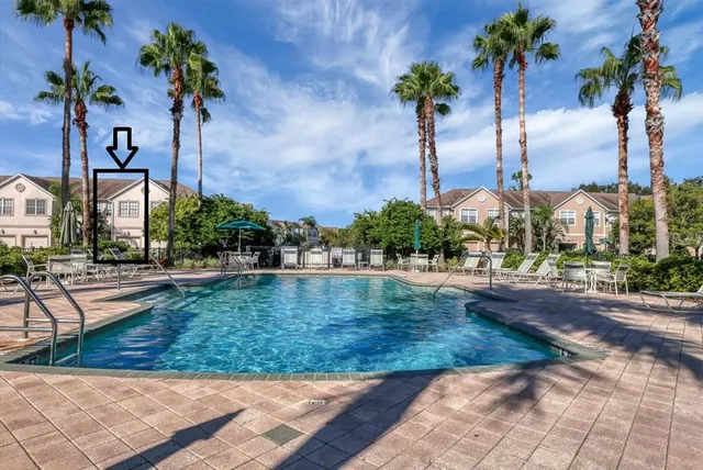 a view of a palm trees in front of a building