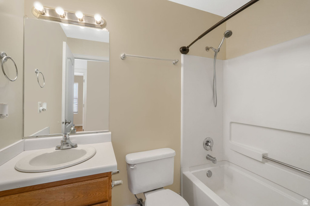7936 Wycliffe Way Eagle Mountain, UT 84005 - Photo 16 of 37 Full bathroom with vanity and bathing tub / shower combination