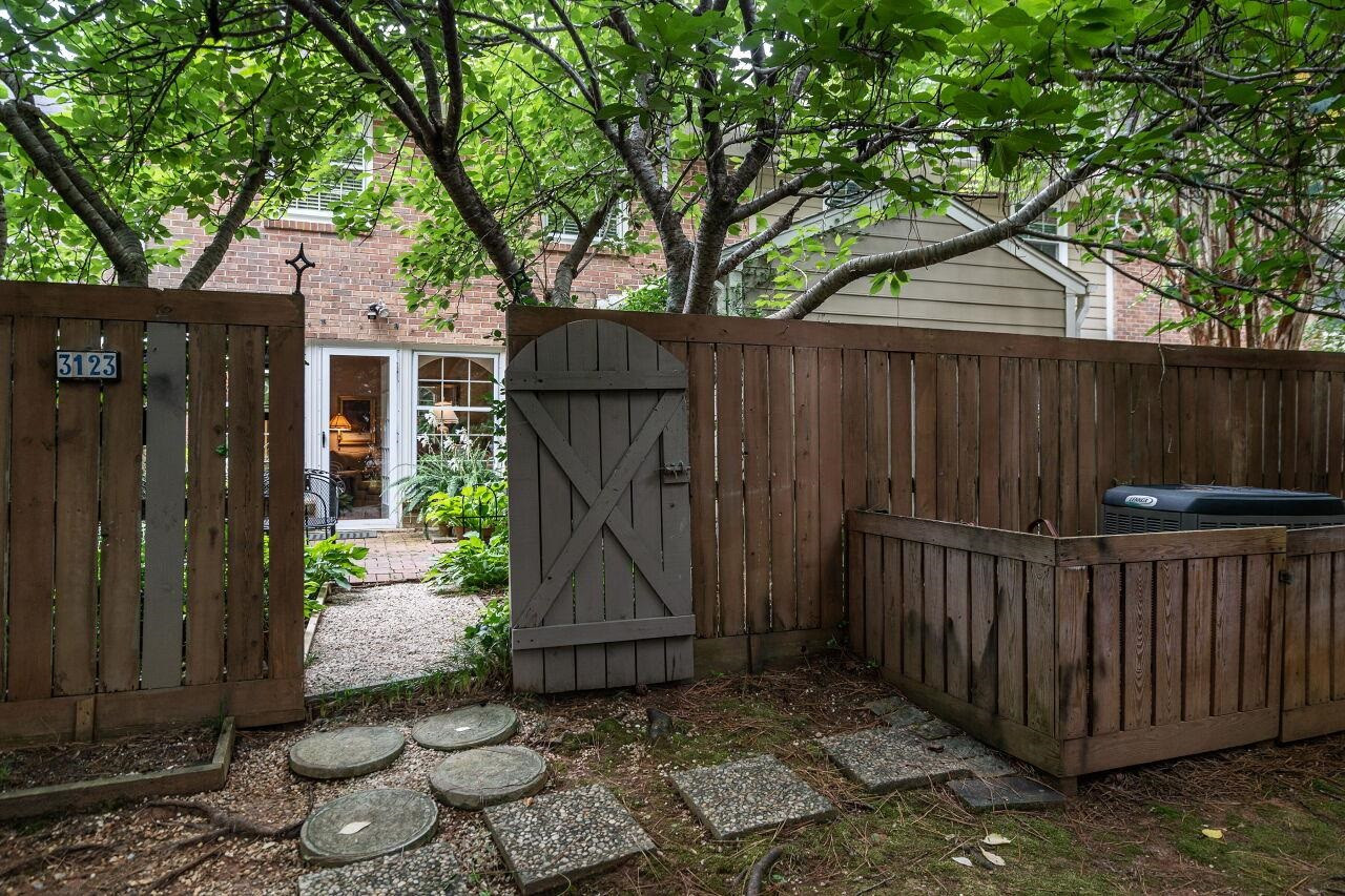 3123 Morningside Drive Raleigh, NC 27607 - Photo 24 of 28 ...shows thoughtful placement of the HVAC outdoor unit -- located outside the enclosed patio, to allow conversation when the unit is running. Rear Gate to Patio