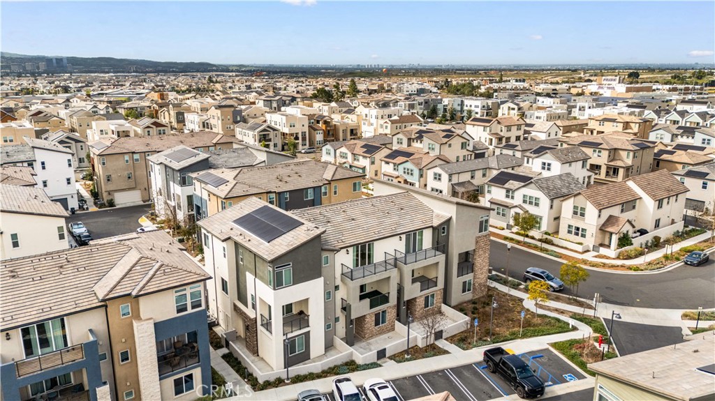 312 Tank Irvine, CA 92618 - Photo 50 of 75 an aerial view of a residential apartment building with parking space