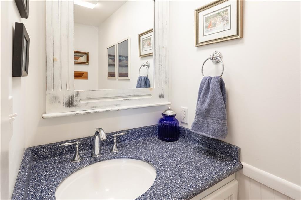 60 Lowells Cove Road Orrs Island, ME 04066 - Photo 11 of 27 The guest powder room is off the entry.
