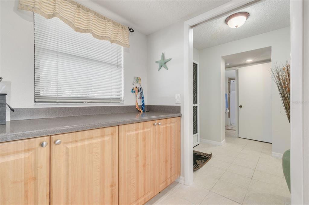 8701 Midnight Pass Road, Unit 106A Sarasota, FL 34242 - Photo 13 of 54 a bathroom with a granite countertop sink and a mirror