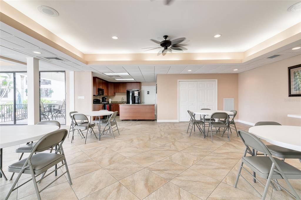8701 Midnight Pass Road, Unit 106A Sarasota, FL 34242 - Photo 38 of 54 a view of a dining room with furniture