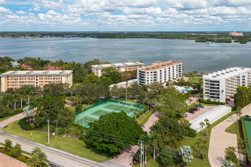 8701 Midnight Pass Road, Unit 106A Sarasota, FL 34242 - Photo 52 of 54 a view of a lake with a city view
