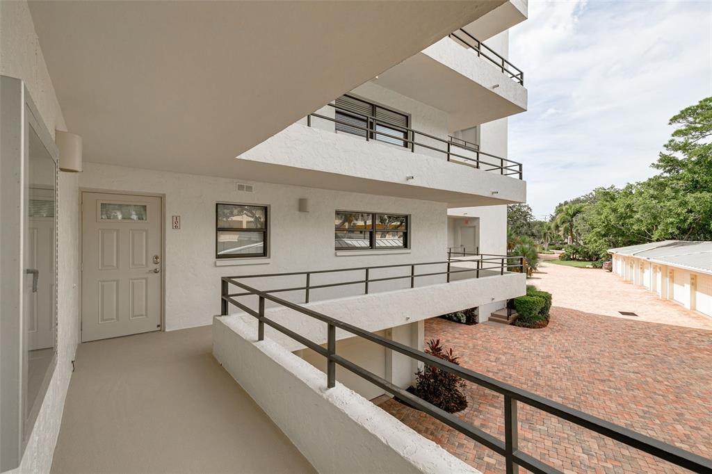 8701 Midnight Pass Road, Unit 106A Sarasota, FL 34242 - Photo 9 of 54 a view of outdoor space and seating area