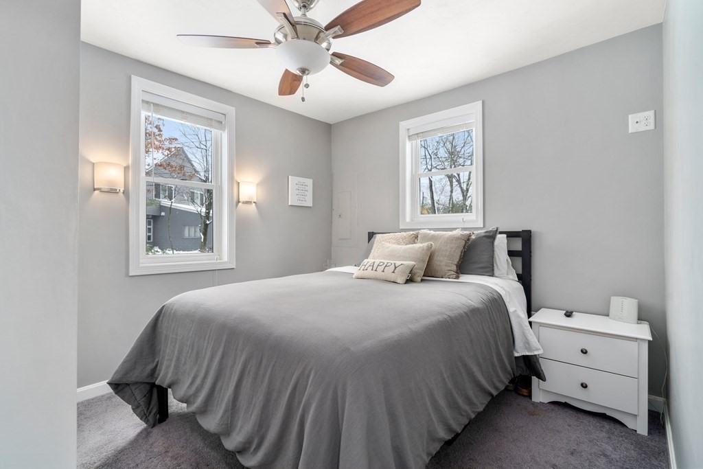 49 Woody Island Road Hopkinton, MA 01748 - Photo 13 of 33 a bedroom with a bed and a window