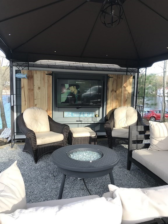 49 Woody Island Road Hopkinton, MA 01748 - Photo 32 of 33 a living room with furniture and a fireplace