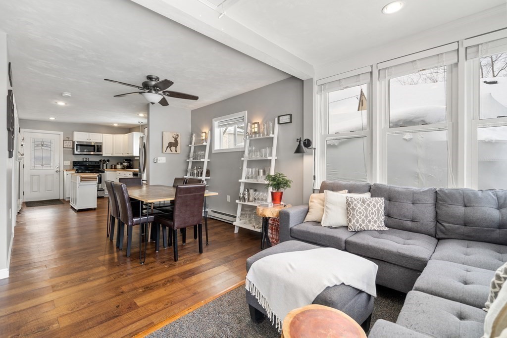 49 Woody Island Road Hopkinton, MA 01748 - Photo 7 of 33 a living room with furniture kitchen view and a large window