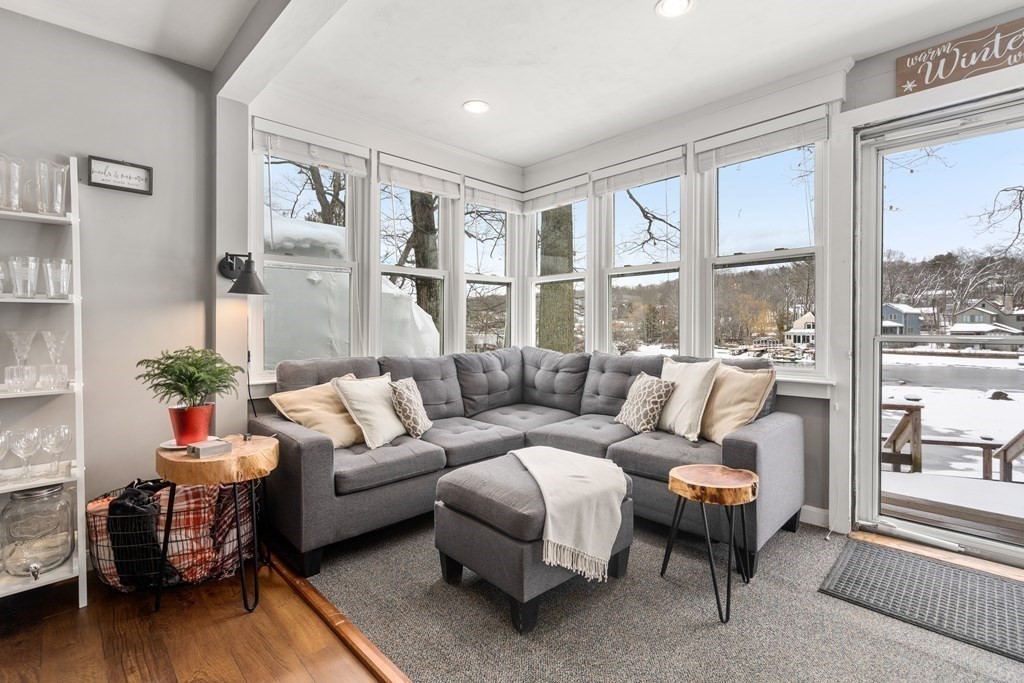 49 Woody Island Road Hopkinton, MA 01748 - Photo 8 of 33 a living room with furniture and a large window