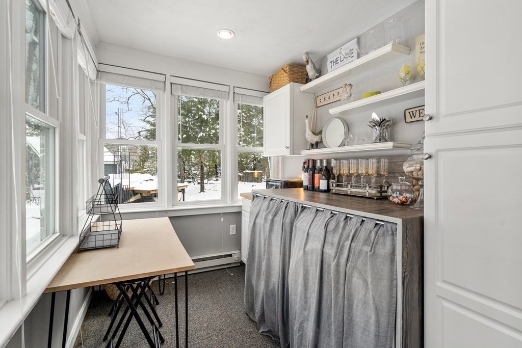 49 Woody Island Road Hopkinton, MA 01748 - Photo 10 of 33 a view of a dining room with furniture window and outside view