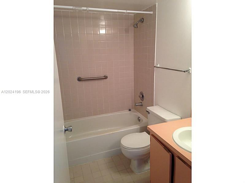 8260 Southwest 210th Street, Unit 319 Cutler Bay, FL 33189 - Photo 6 of 20 a bathroom with a sink a toilet and shower
