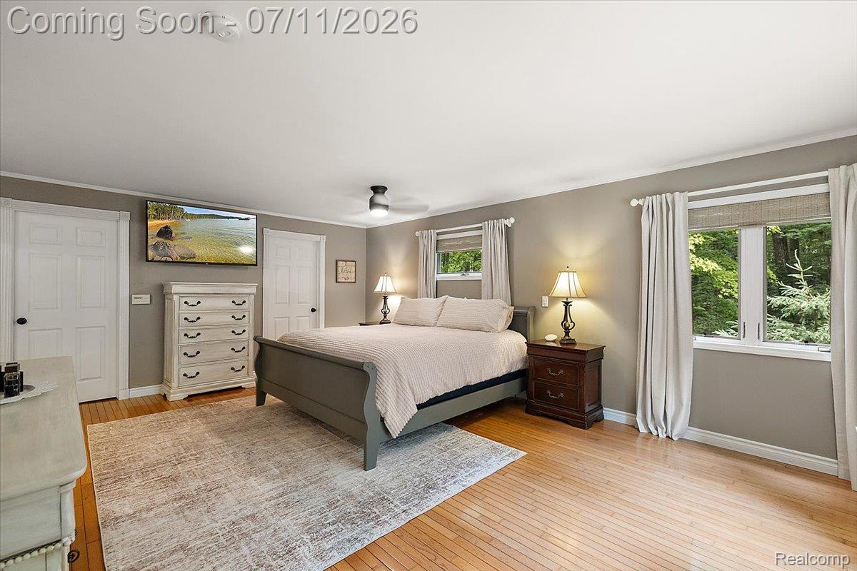 4219 Gardner Road Metamora, MI 48455 - Photo 23 of 87 Spacious room featuring wood-finish flooring, light grey walls, and white trim