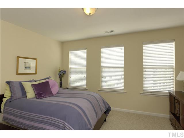 7660 Winners Edge Street Raleigh, NC 27617 - Photo 8 of 12 Secondary bedroom is almost as large as the master and includes triple windows as well for great natural lighting. Private bath is great for guest or roomate situation, roomy closet. Neutral color palette perfect for your paint choices. Washer/Dryer stay.