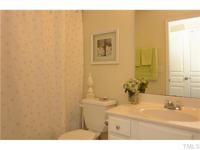 7660 Winners Edge Street Raleigh, NC 27617 - Photo 9 of 12 Second full bath- also includes nickel finish hardware, one piece marble vanity, tile flooring. Home is in great condition, very clean and perfect to show. Home has only had one owner, non smoker, no pets.