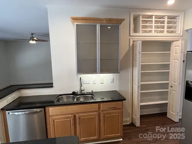 a kitchen with a sink and cabinets