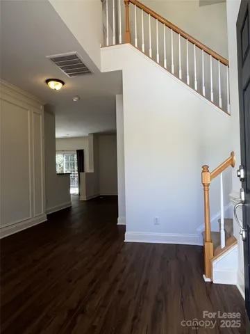 a view of gallery with wooden floor