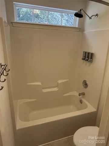 a bathroom with a bath tub