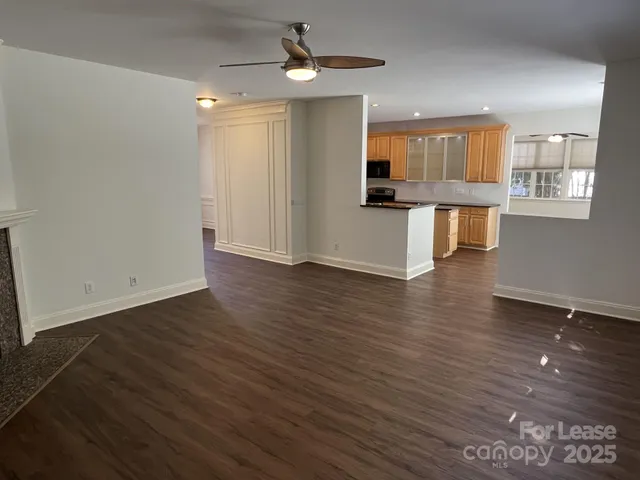 a view of kitchen with cabinets and wooden floor