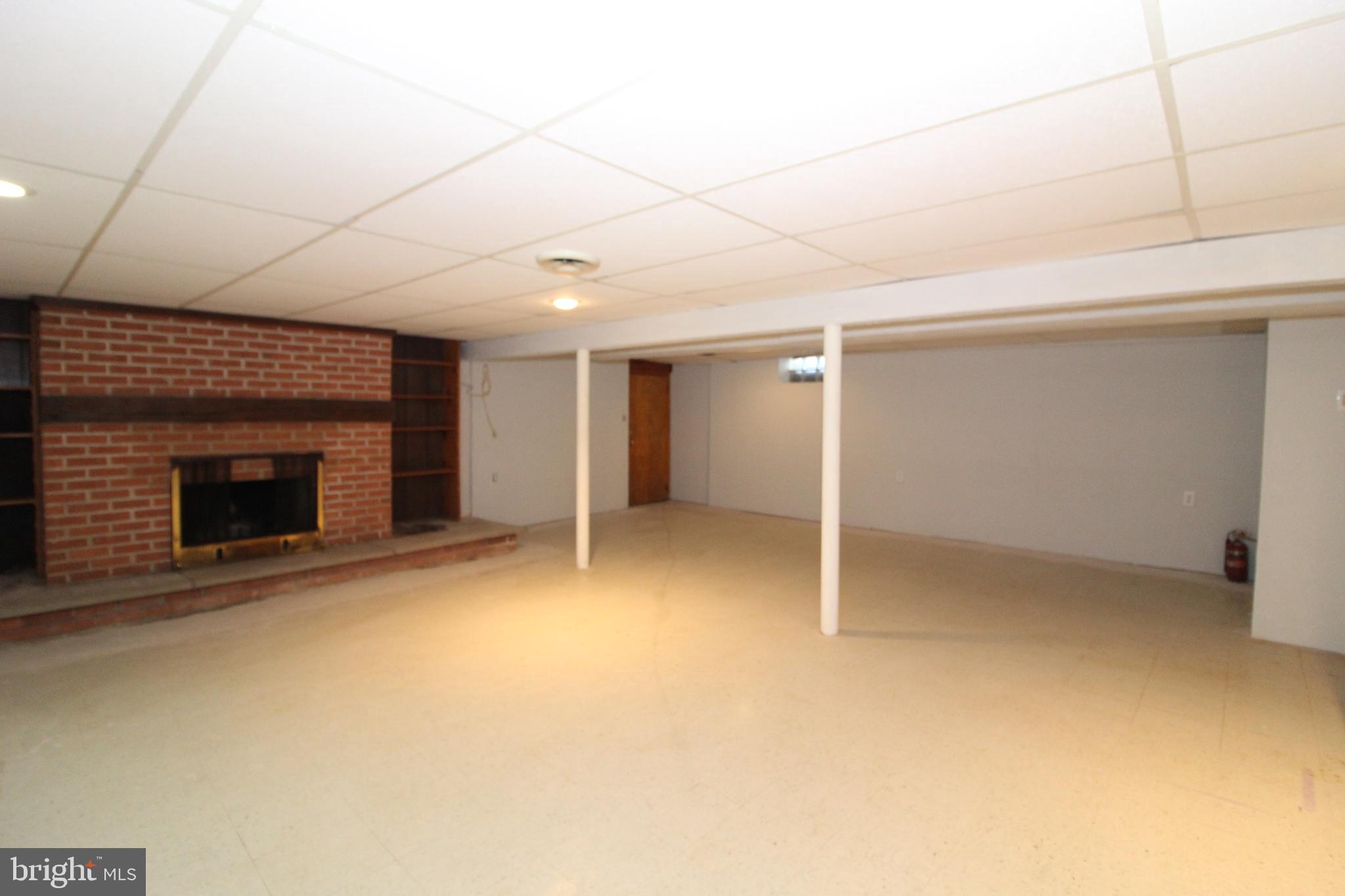 2711 Ebright Road Wilmington, DE 19810 - Photo 27 of 35 Family Room with Brick Fireplace