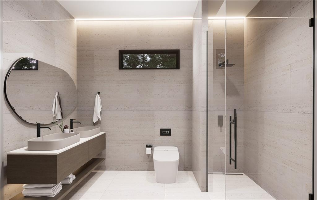 591 Decoupage Drive Fairburn, GA 30213 - Photo 21 of 34 a bathroom with a double vanity sink a toilet and shower