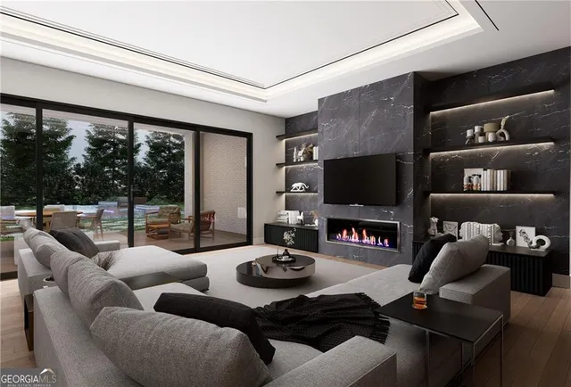 a living room with furniture and wooden floor